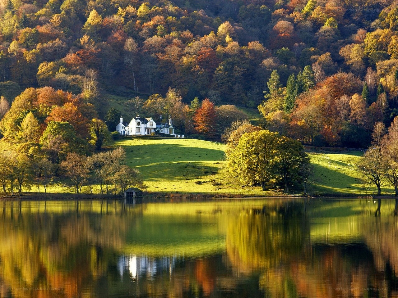 Autumn lake house reflection
