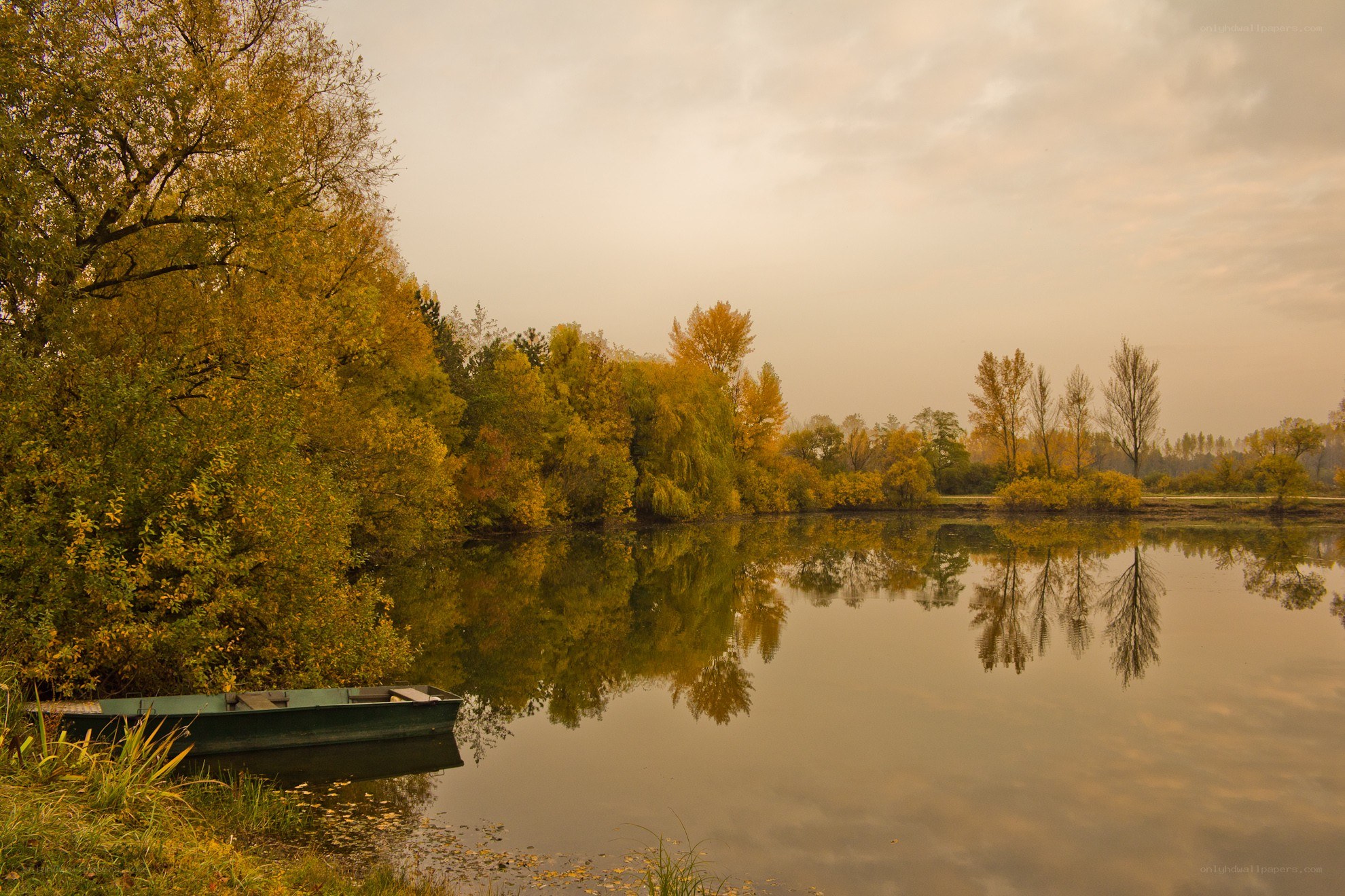 Autumn lake with boat