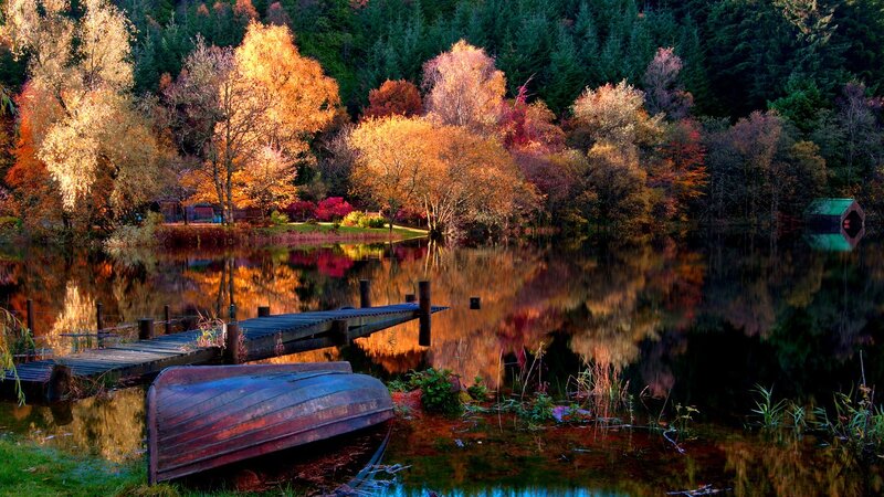 Autumn lake with boat