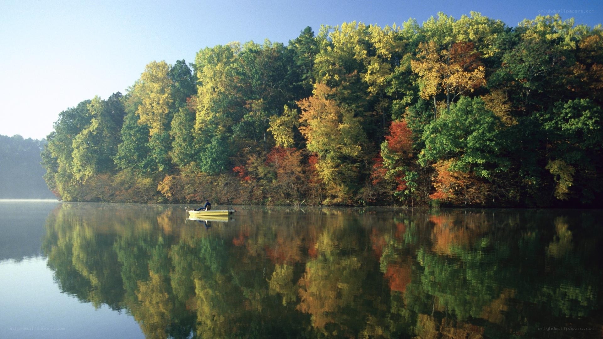 Autumn lake with canoe