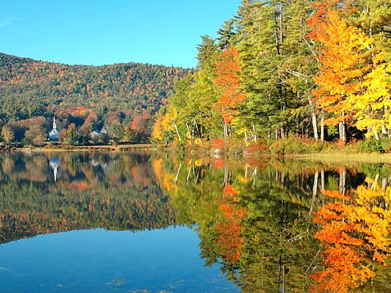 Autumn lake with church reflection