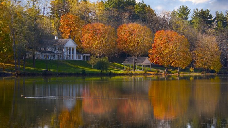 Autumn lake with house and gazebo