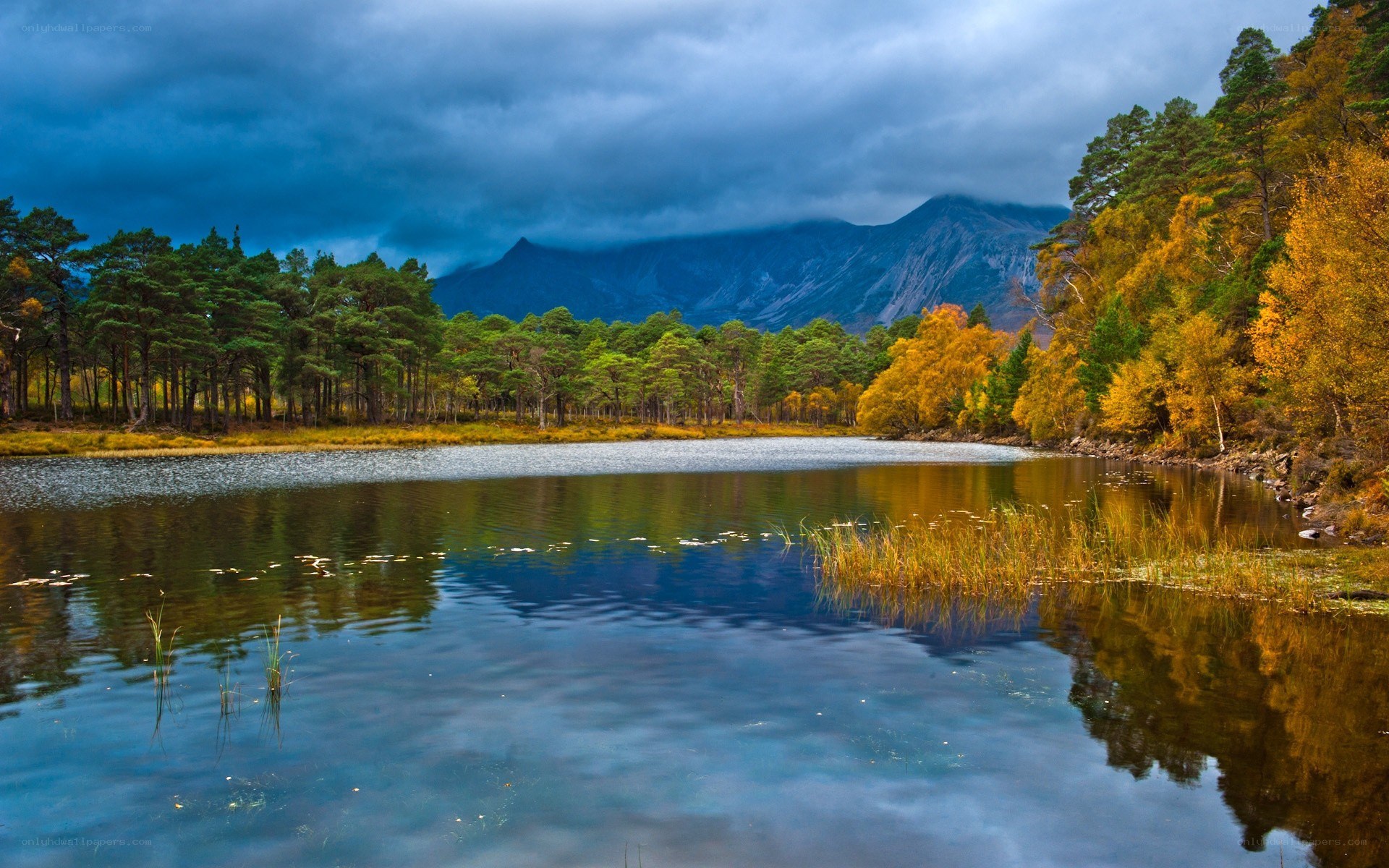 Autumn lake with mountain backdrop