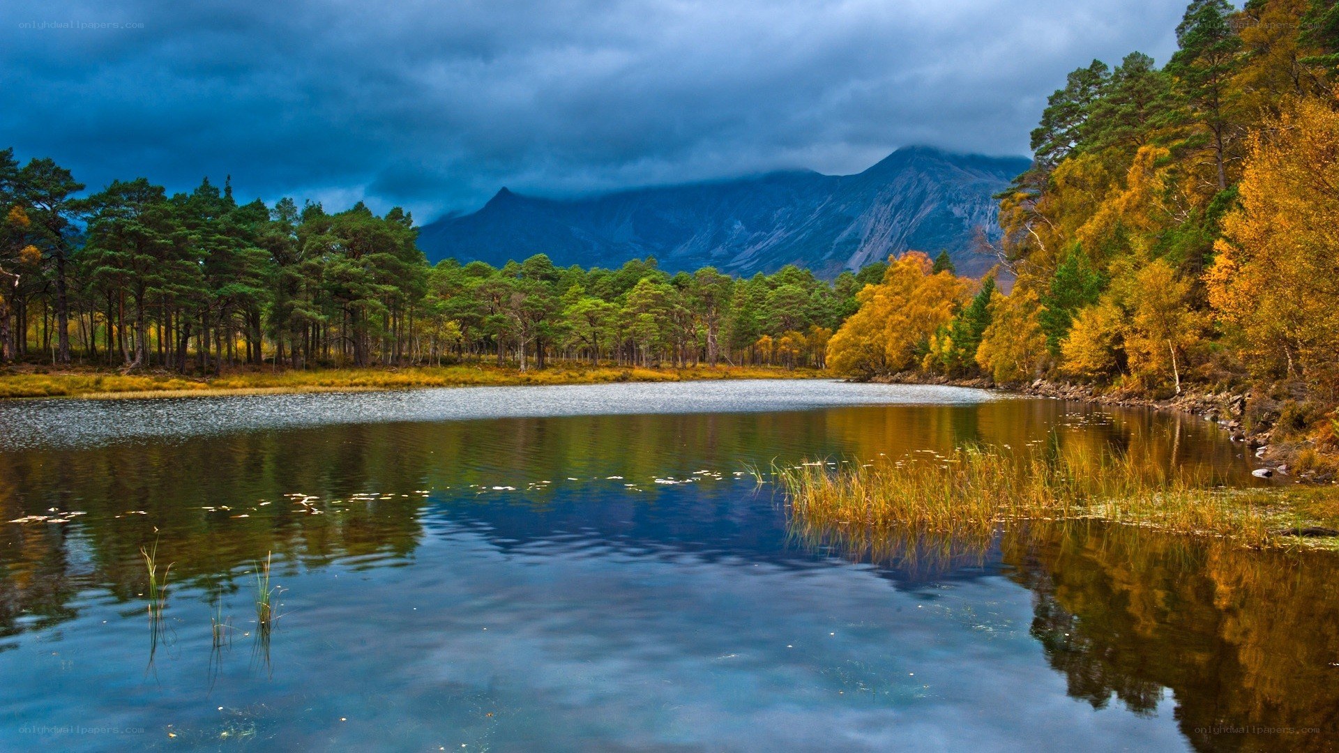 Autumn lake with mountain backdrop