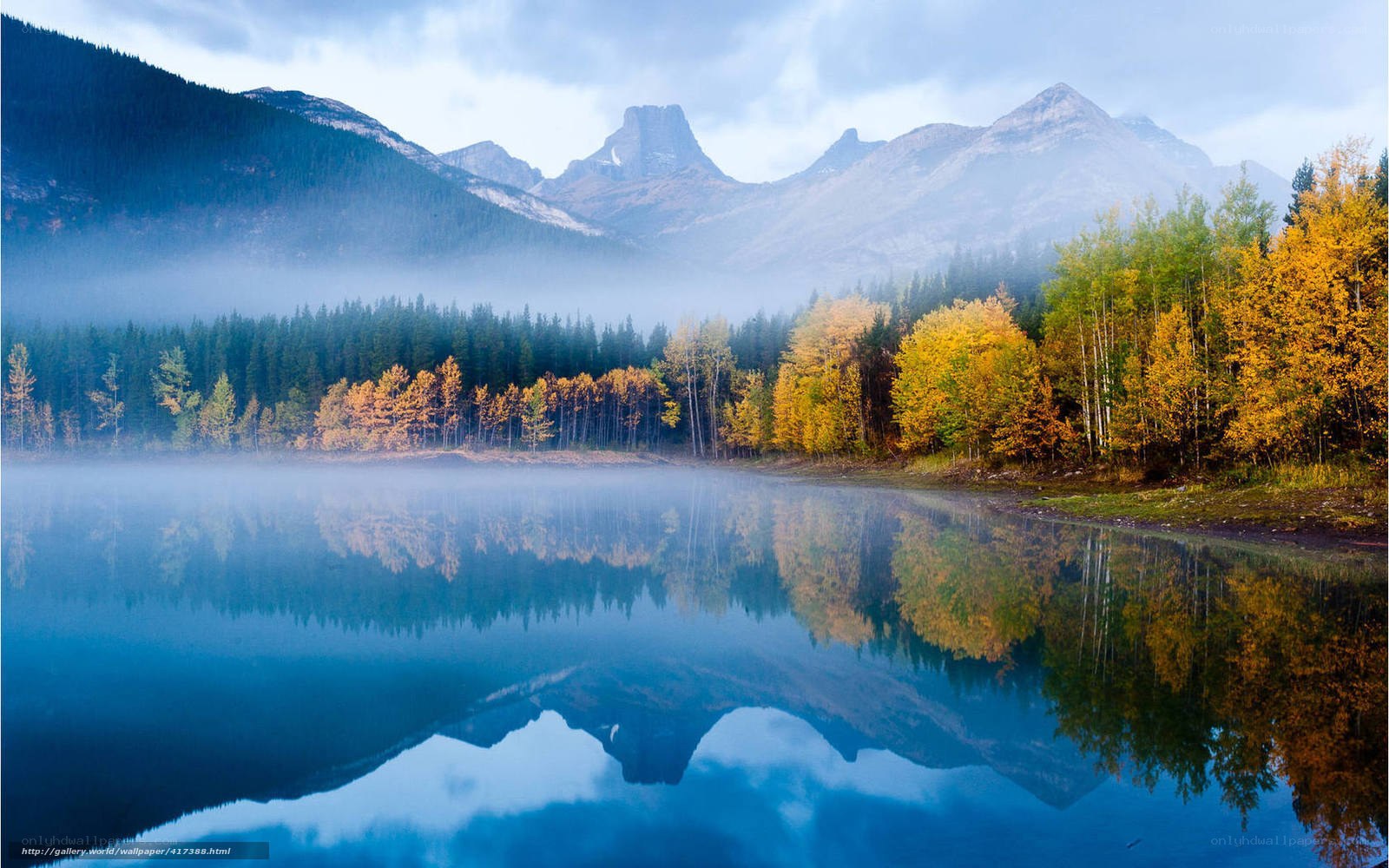 Autumn lake with mountain reflection