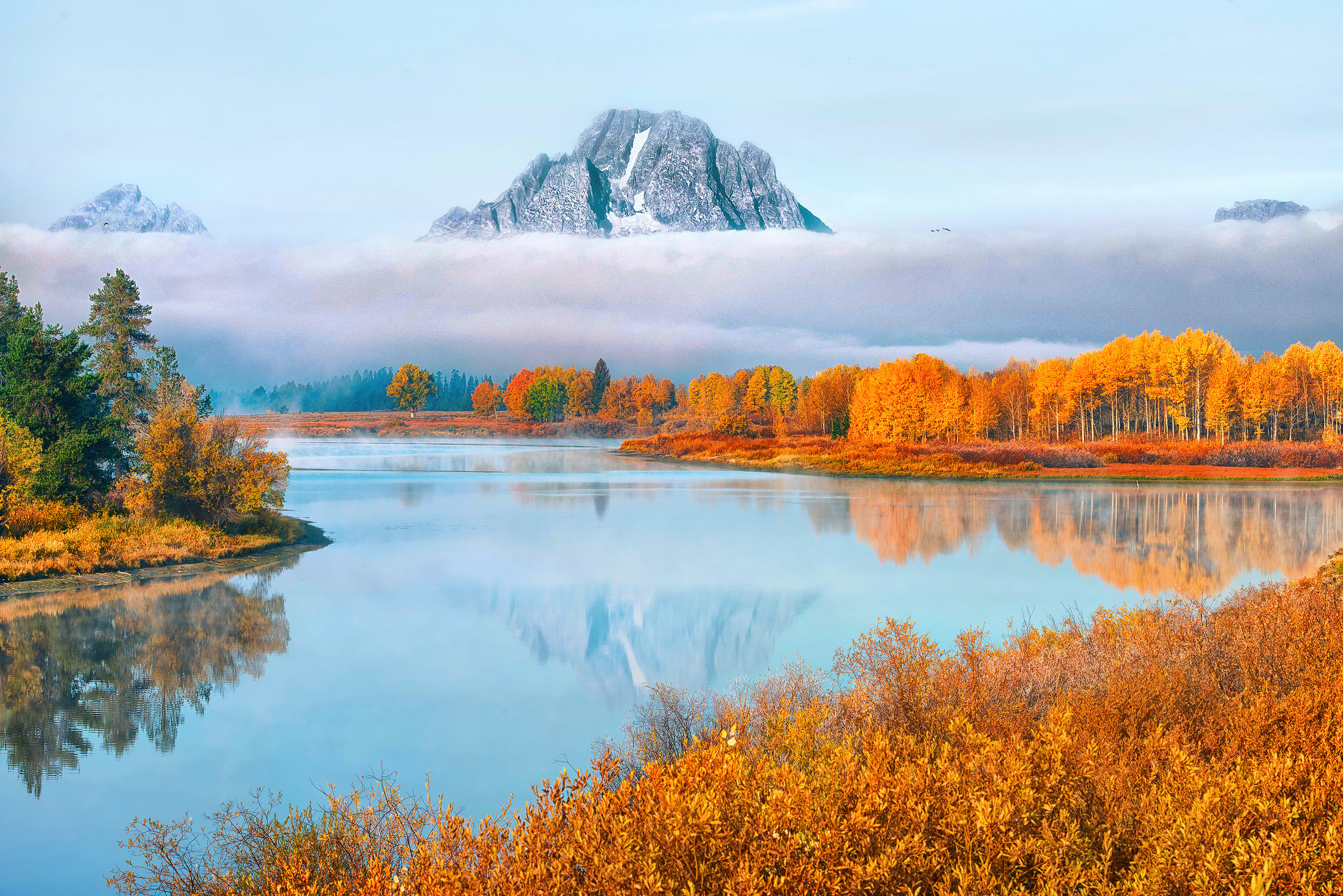 Autumn lake with mountain reflection