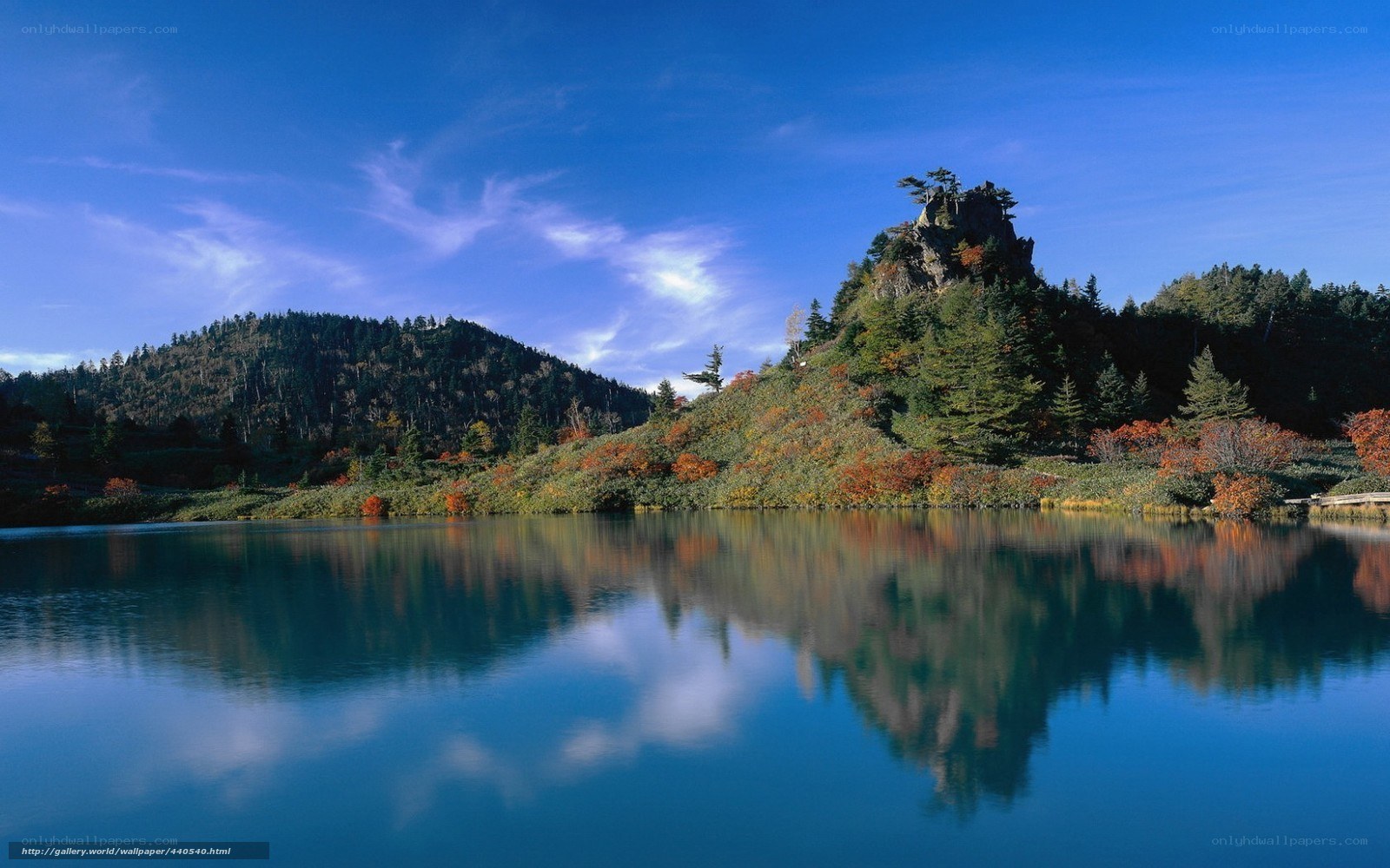 Autumn lake with mountain reflection