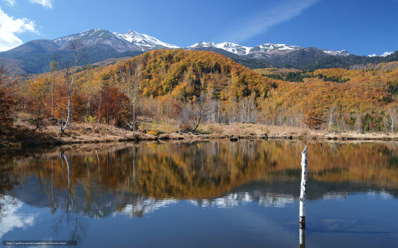 Autumn lake with mountain reflection