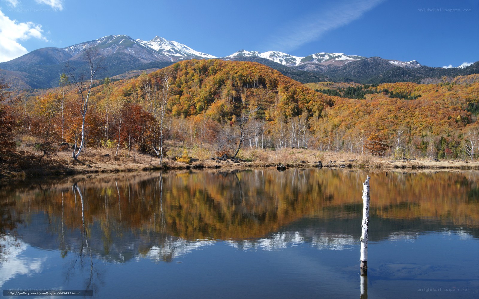 Autumn lake with mountain reflection