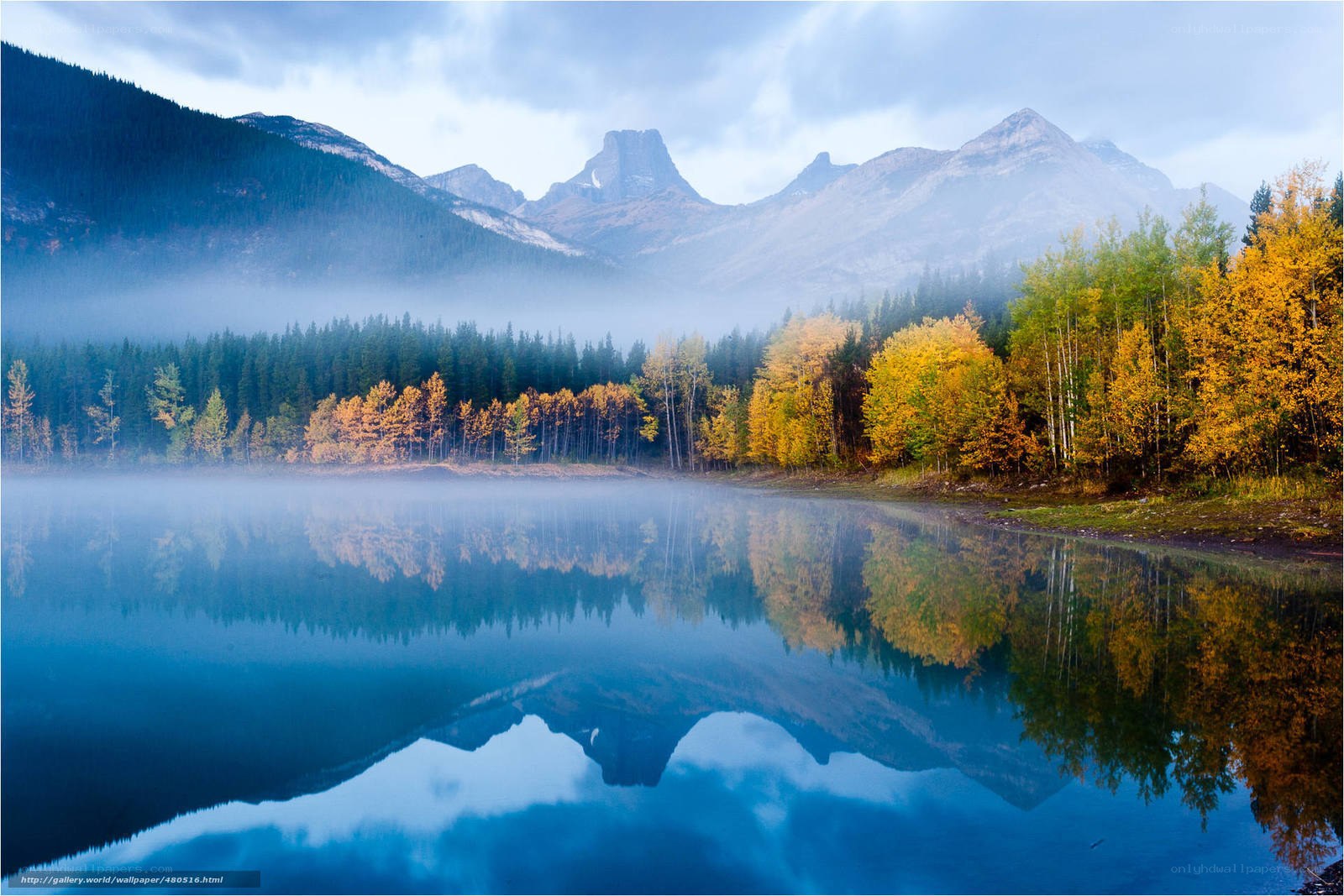 Autumn lake with mountain reflection