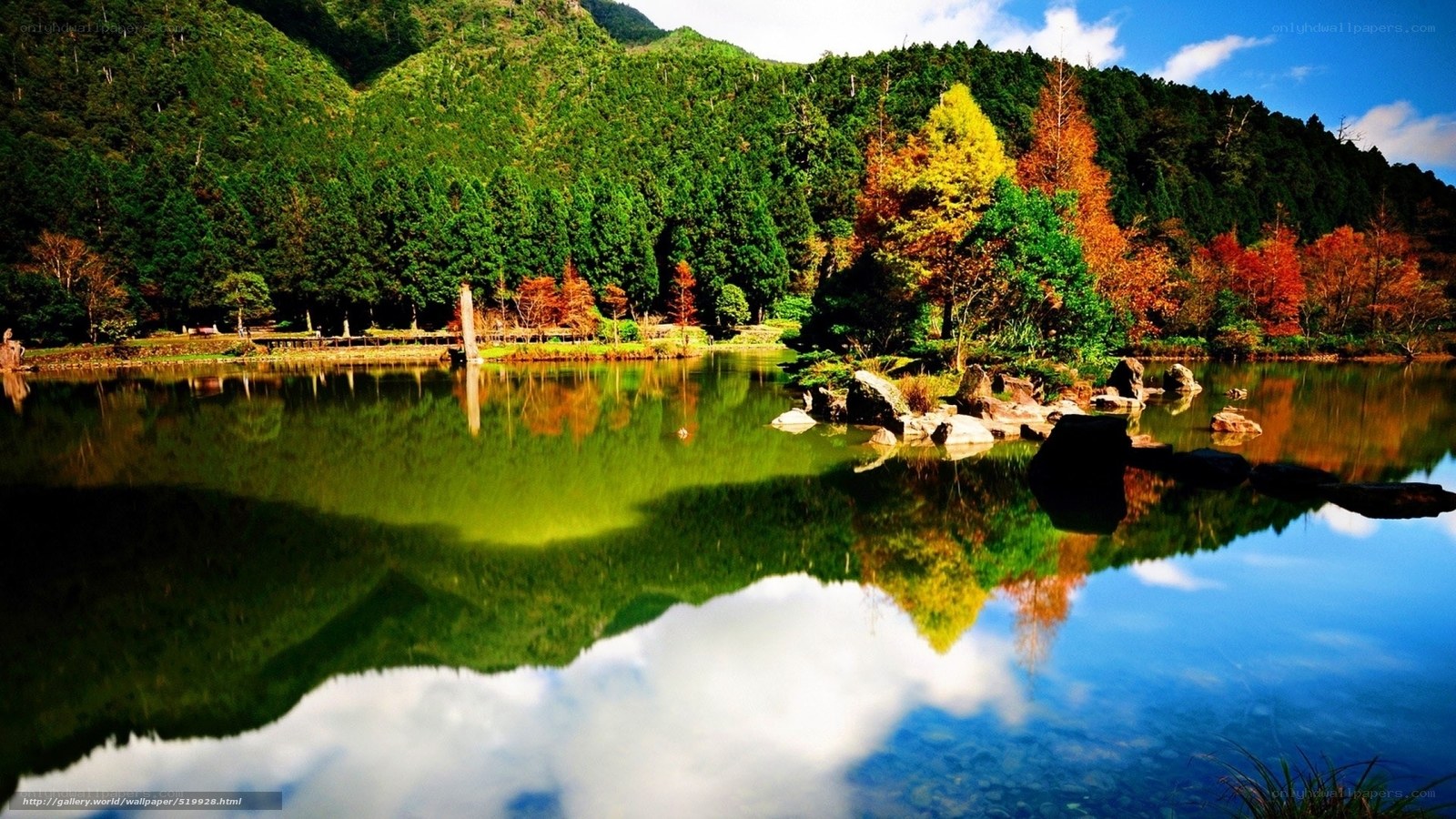 Autumn lake with mountain reflection