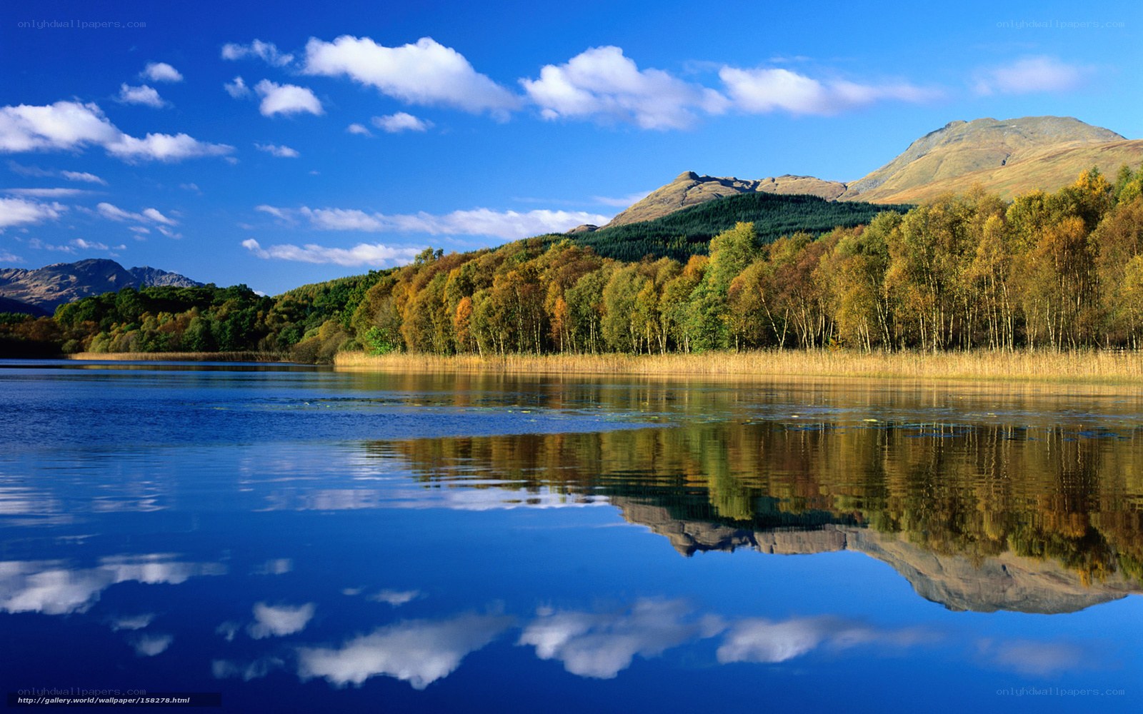 Autumn lake with mountain reflection