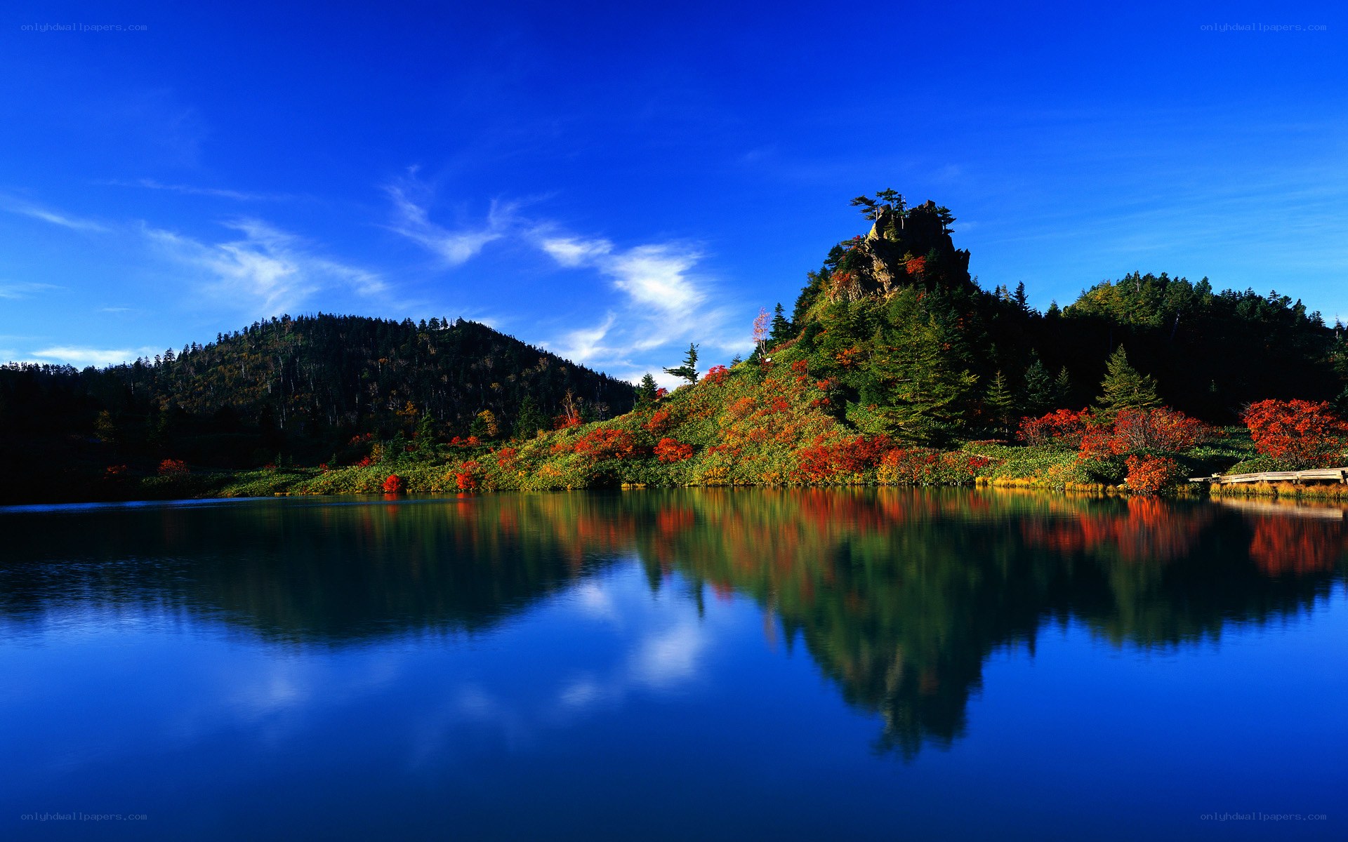 Autumn lake with mountain reflection