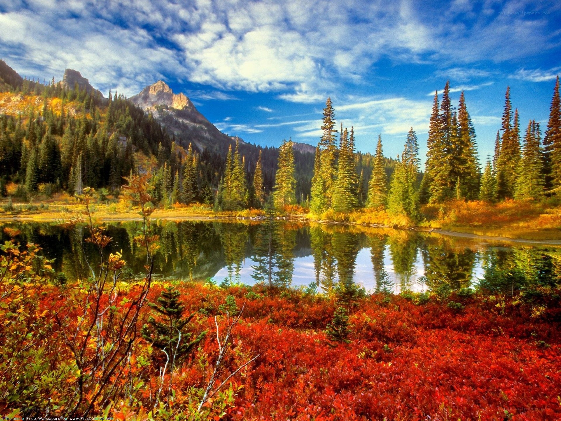 Autumn lake with mountain reflection