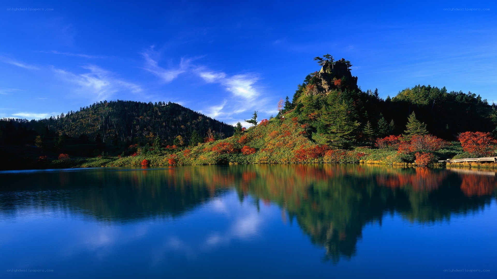 Autumn lake with mountain reflection