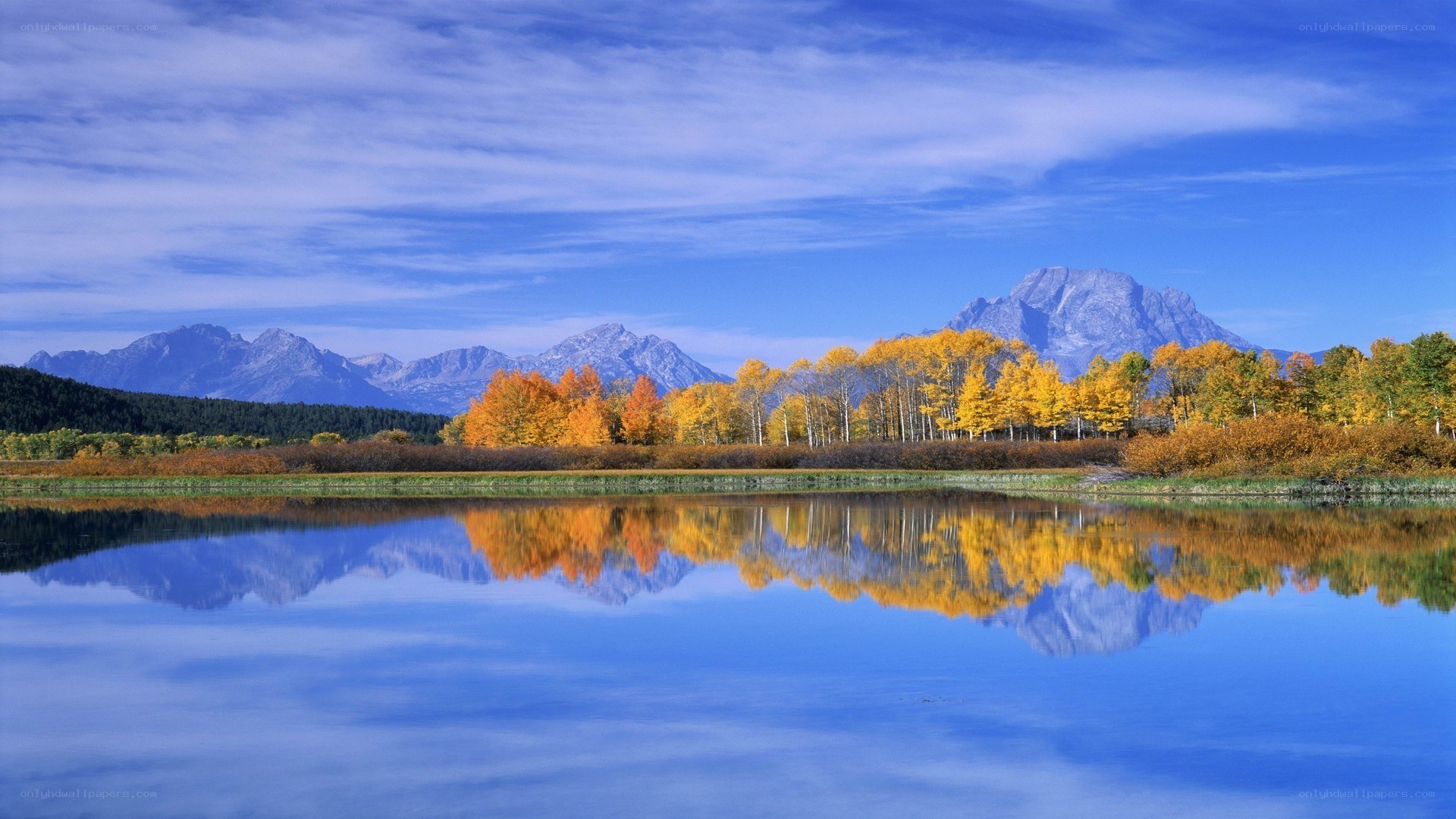 Autumn lake with mountain reflection