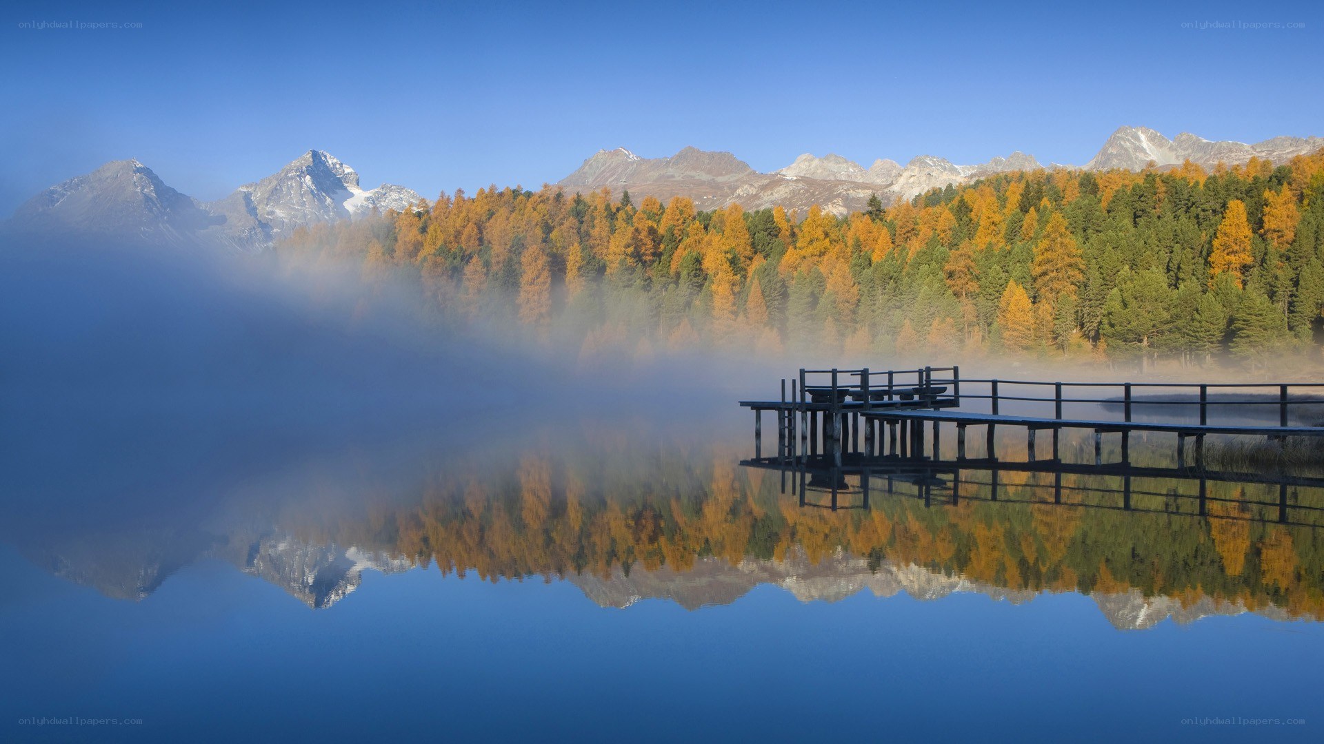 Autumn lake with mountain reflection