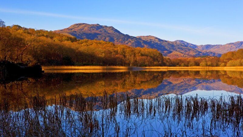 autumn lake with mountain reflection