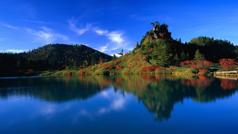 Autumn lake with mountain reflection