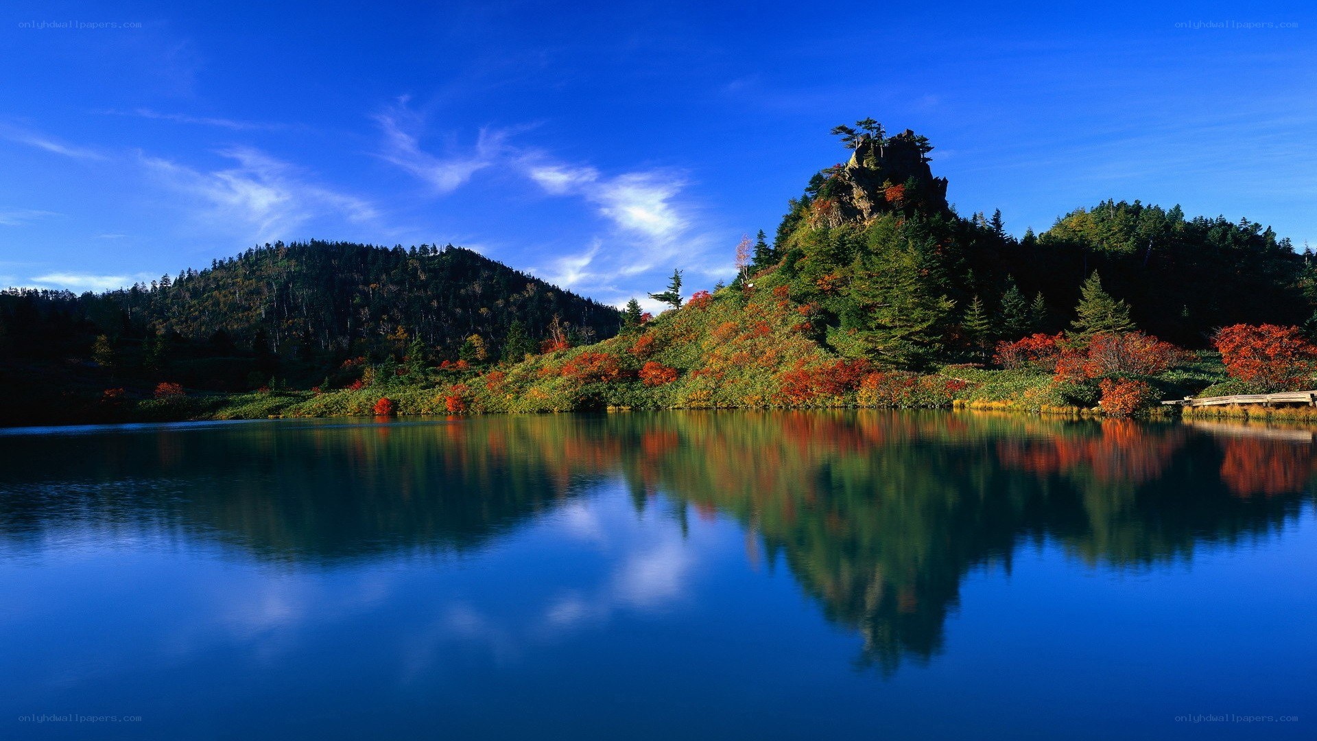 Autumn lake with mountain reflection