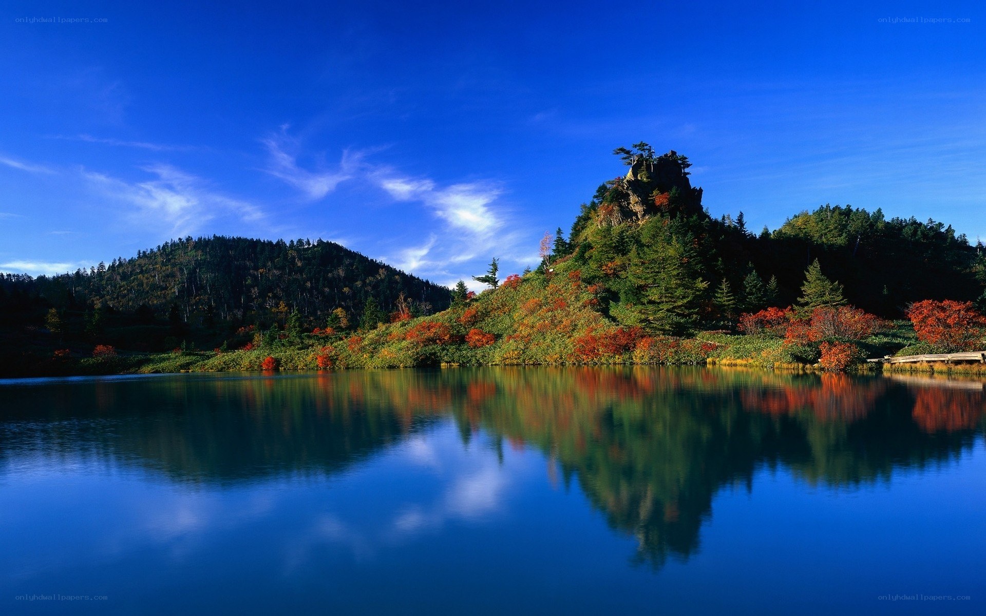 Autumn lake with mountain reflection