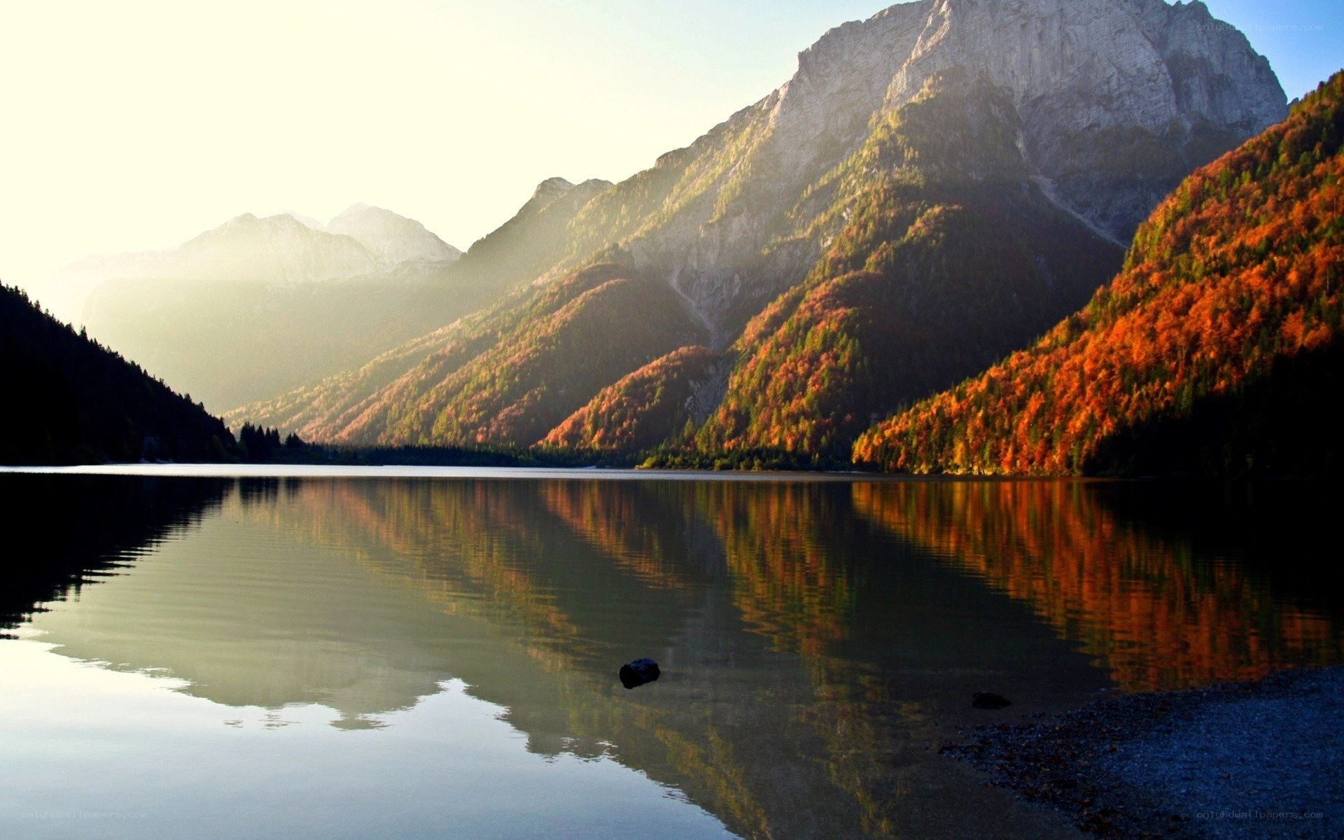 Autumn lake with mountain reflection