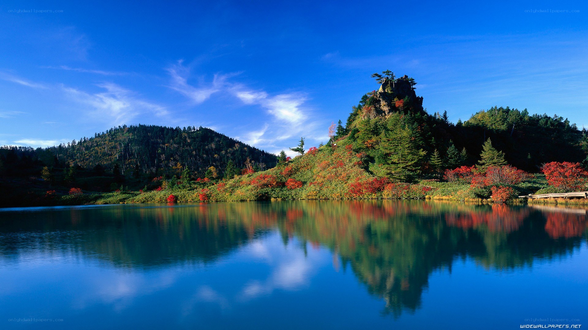 Autumn lake with mountain reflection