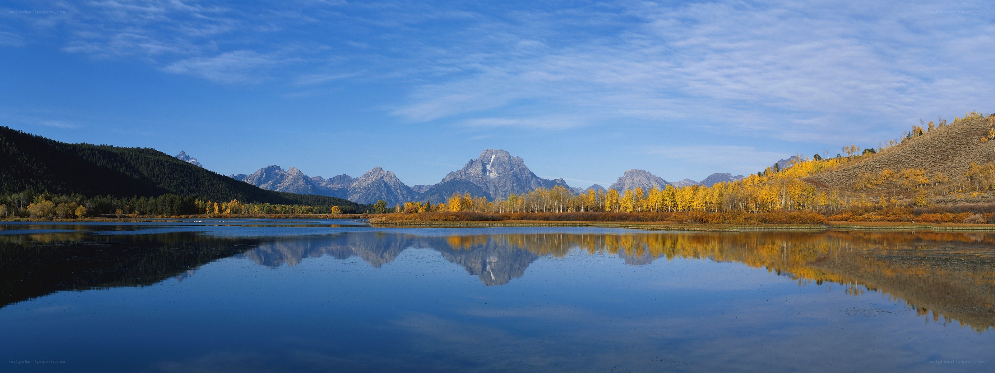 Autumn lake with mountain reflection