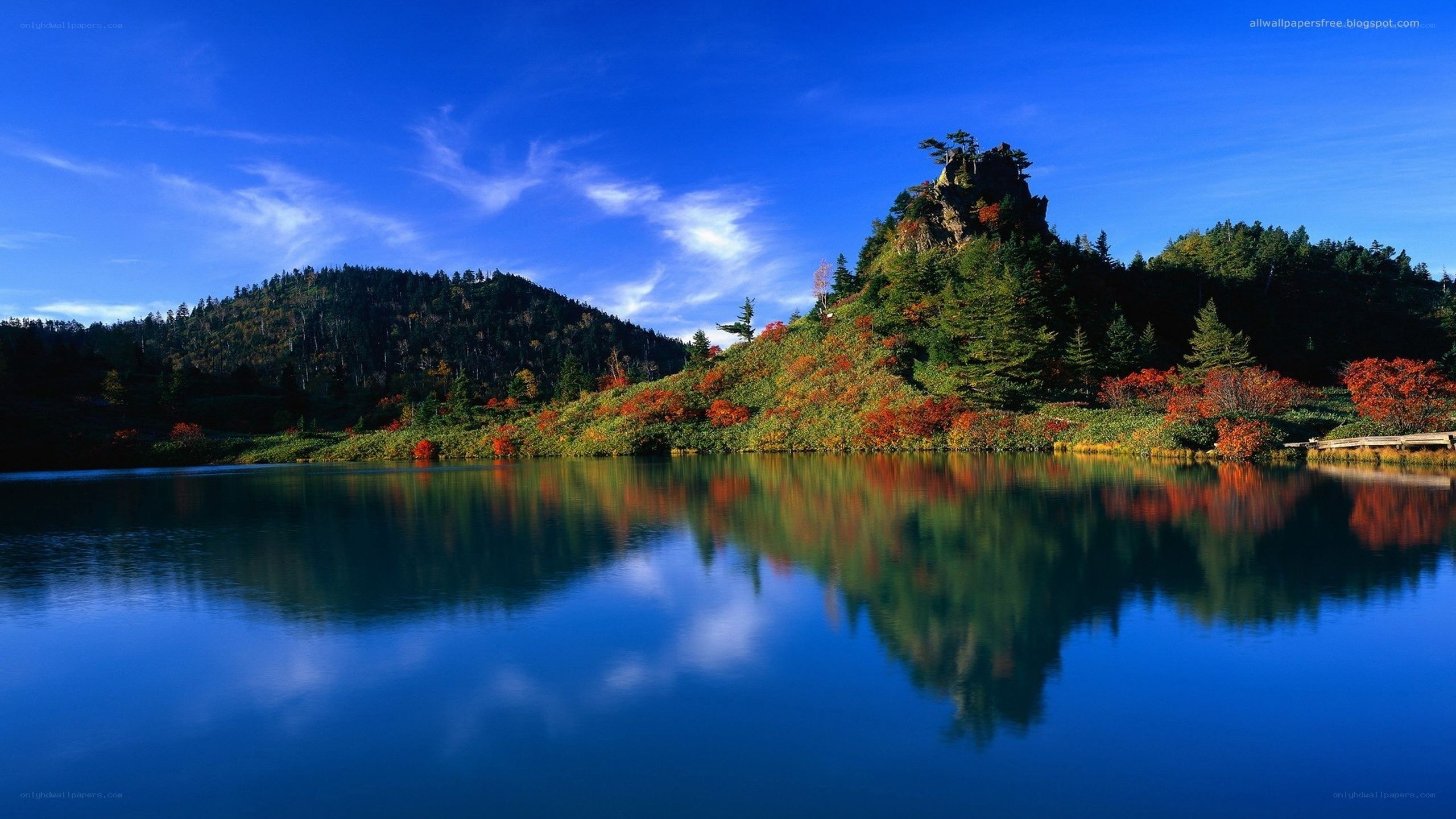 Autumn lake with mountain reflection