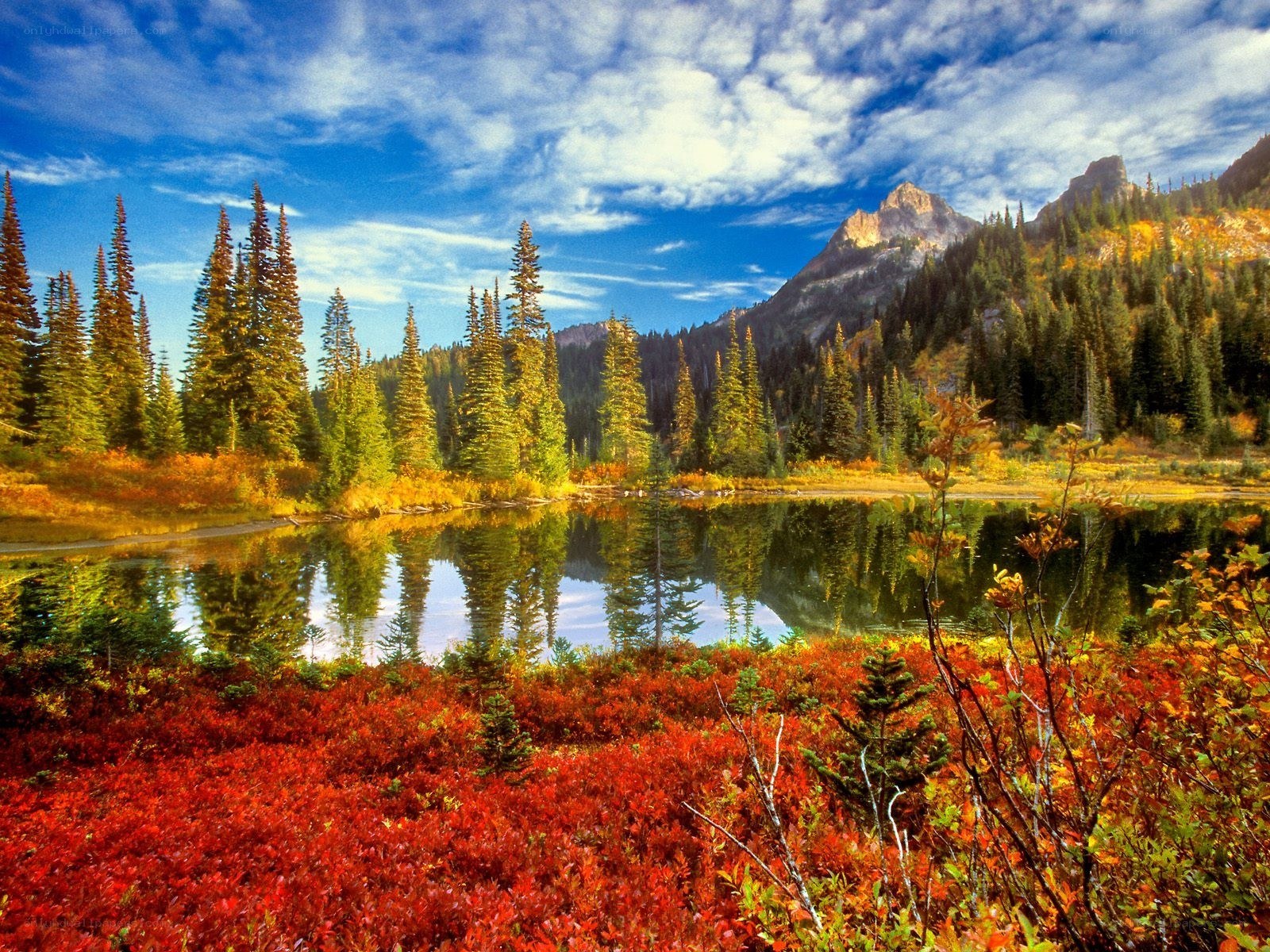 Autumn lake with mountain reflection