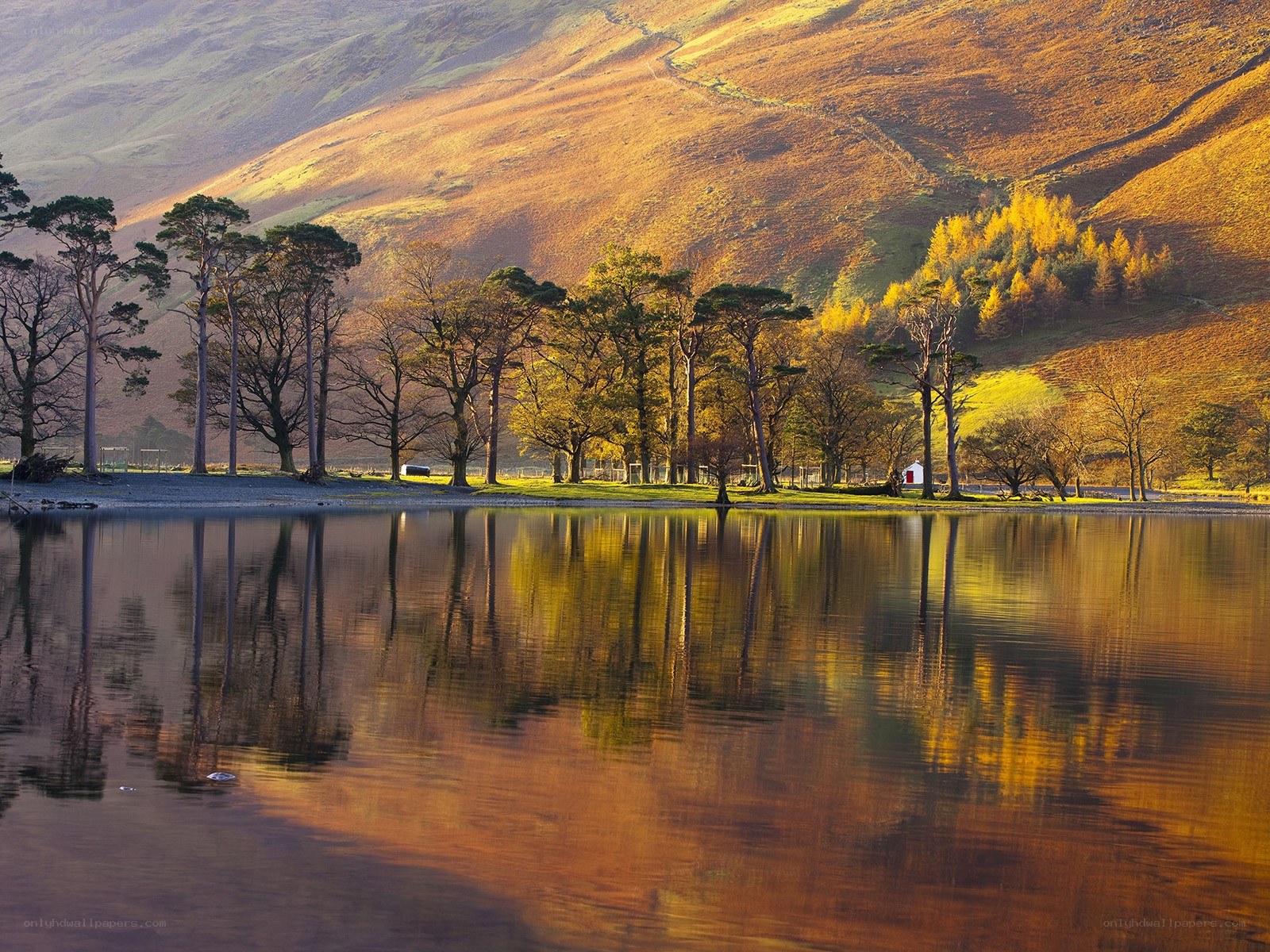 Autumn lake with mountain reflection