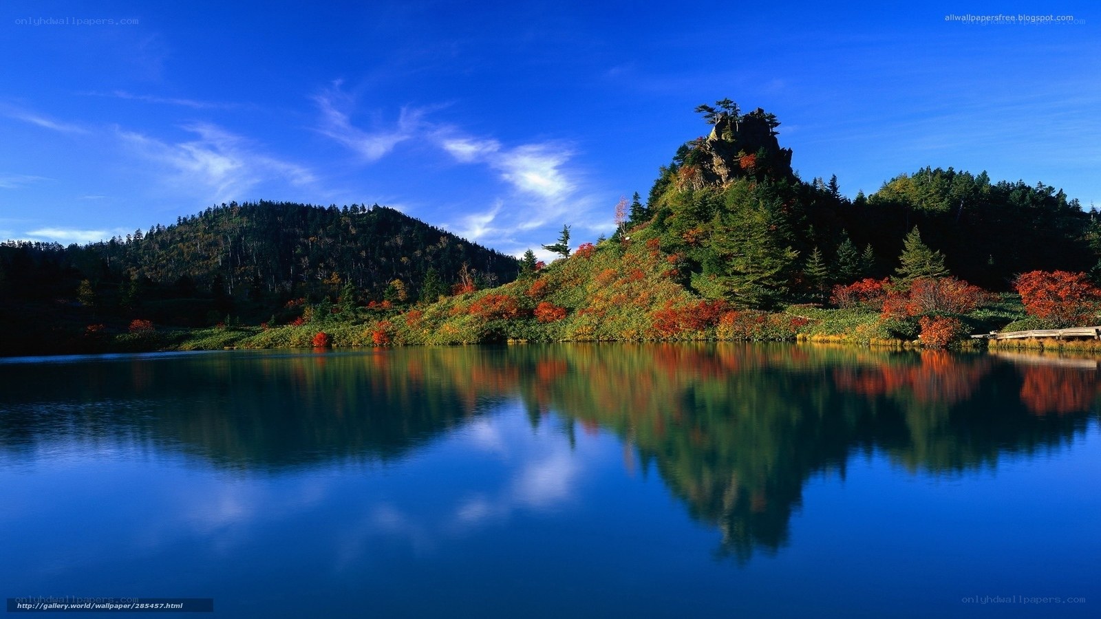 Autumn lake with mountain reflection