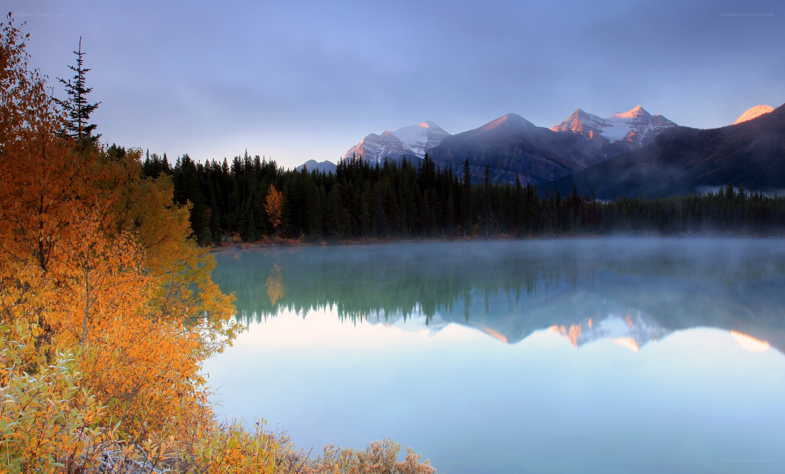 Autumn lake with mountain reflection