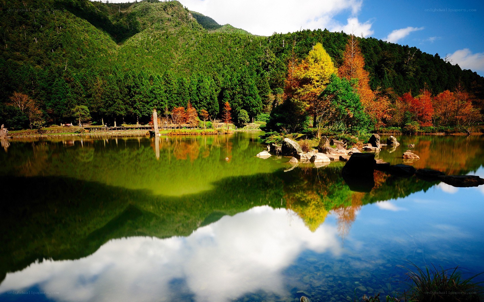 Autumn lake with mountain reflection