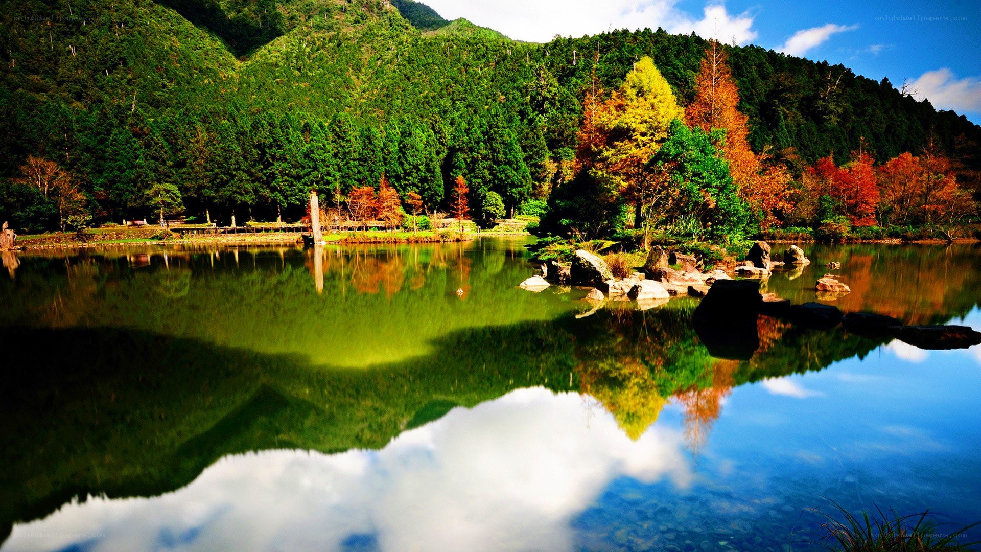 Autumn lake with mountain reflection