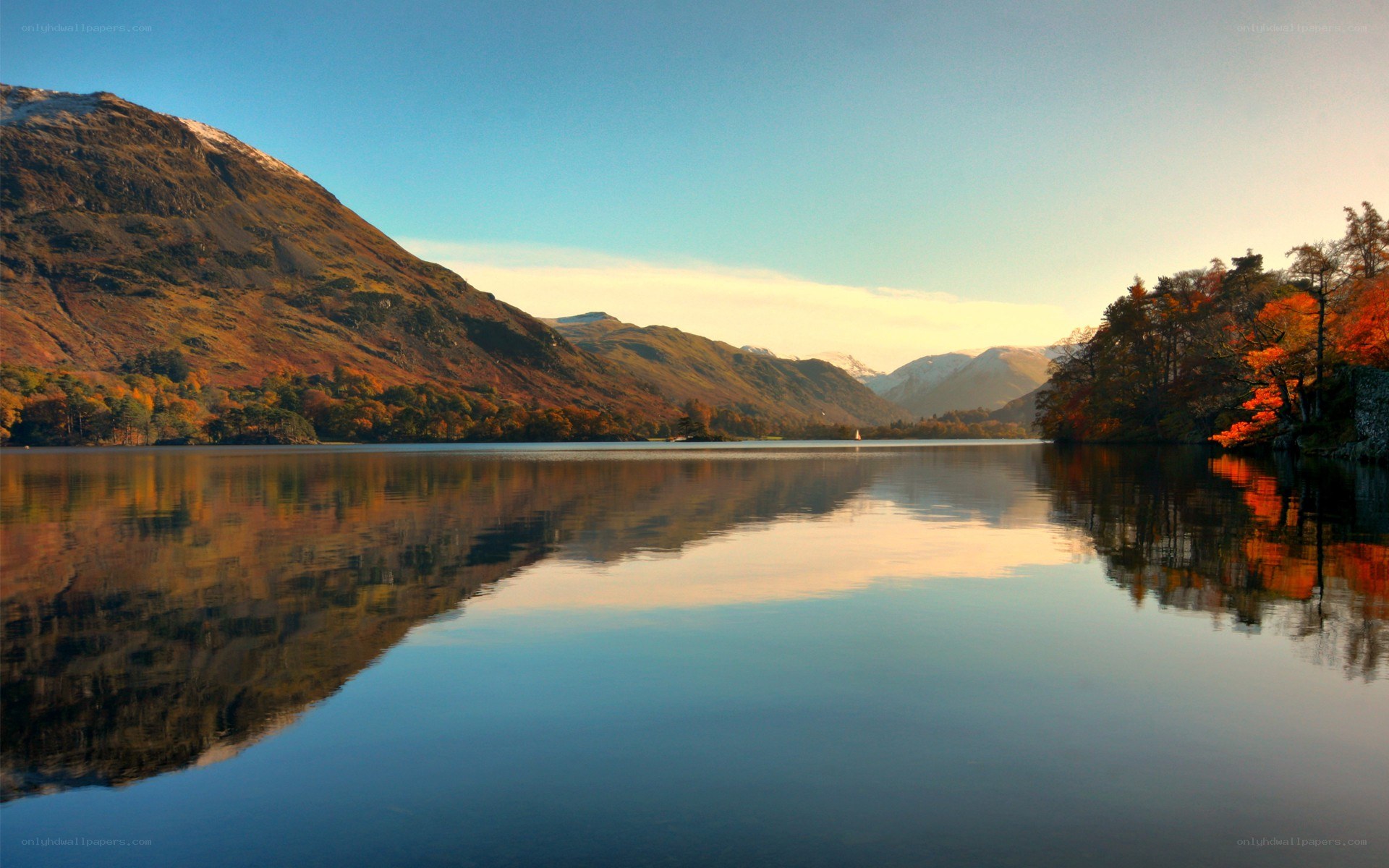 Autumn lake with mountain reflection