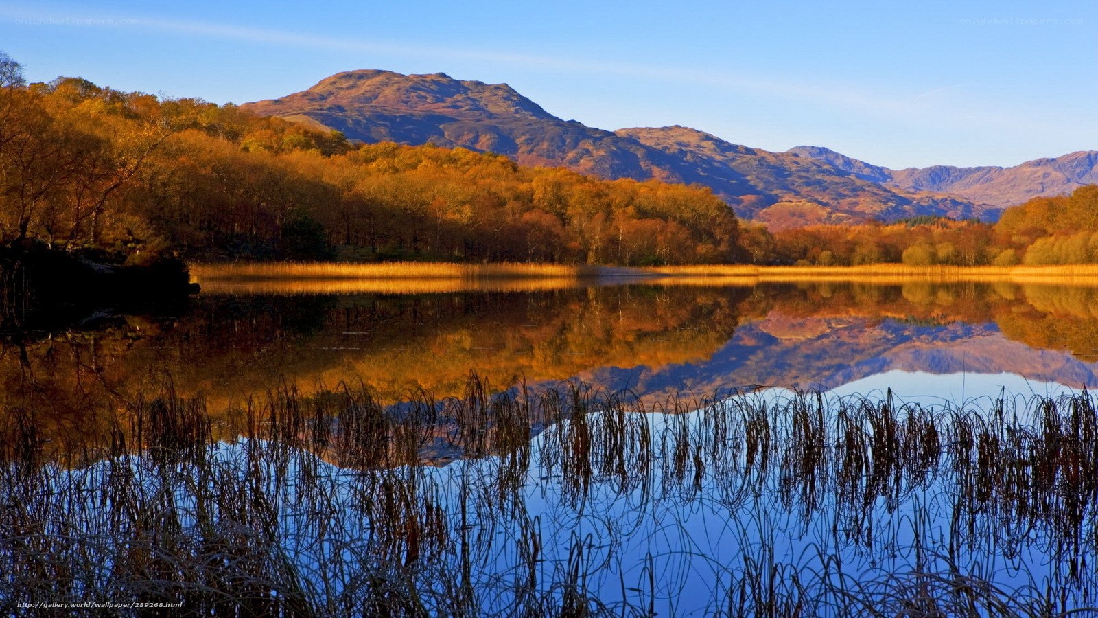 Autumn lake with mountain reflection