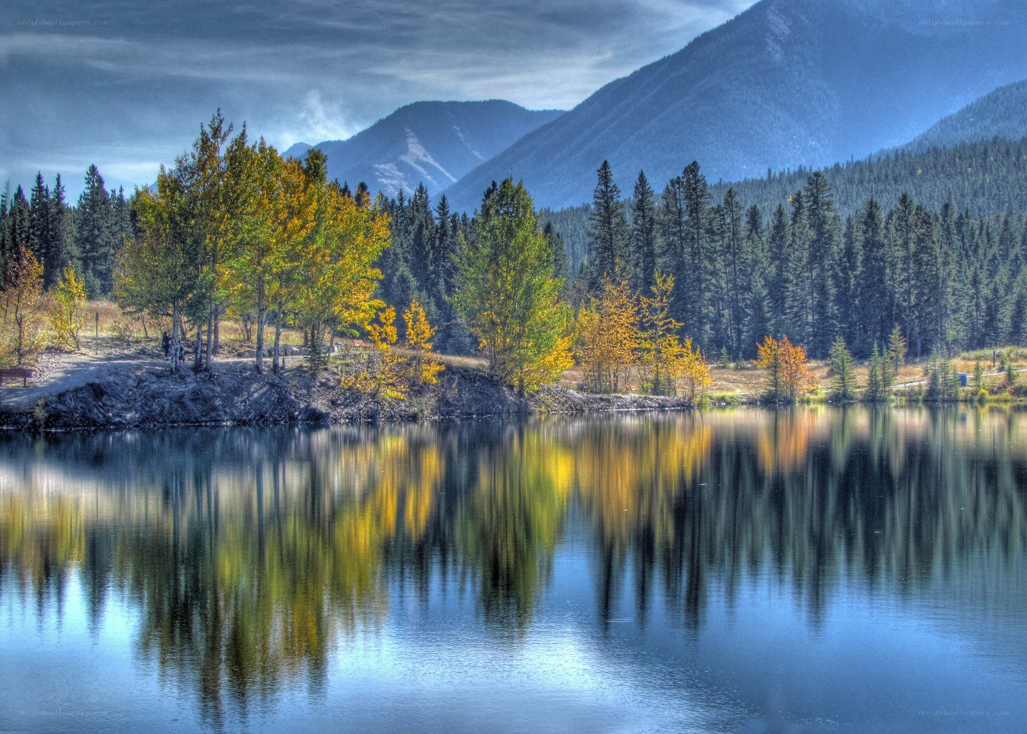Autumn lake with mountain reflection