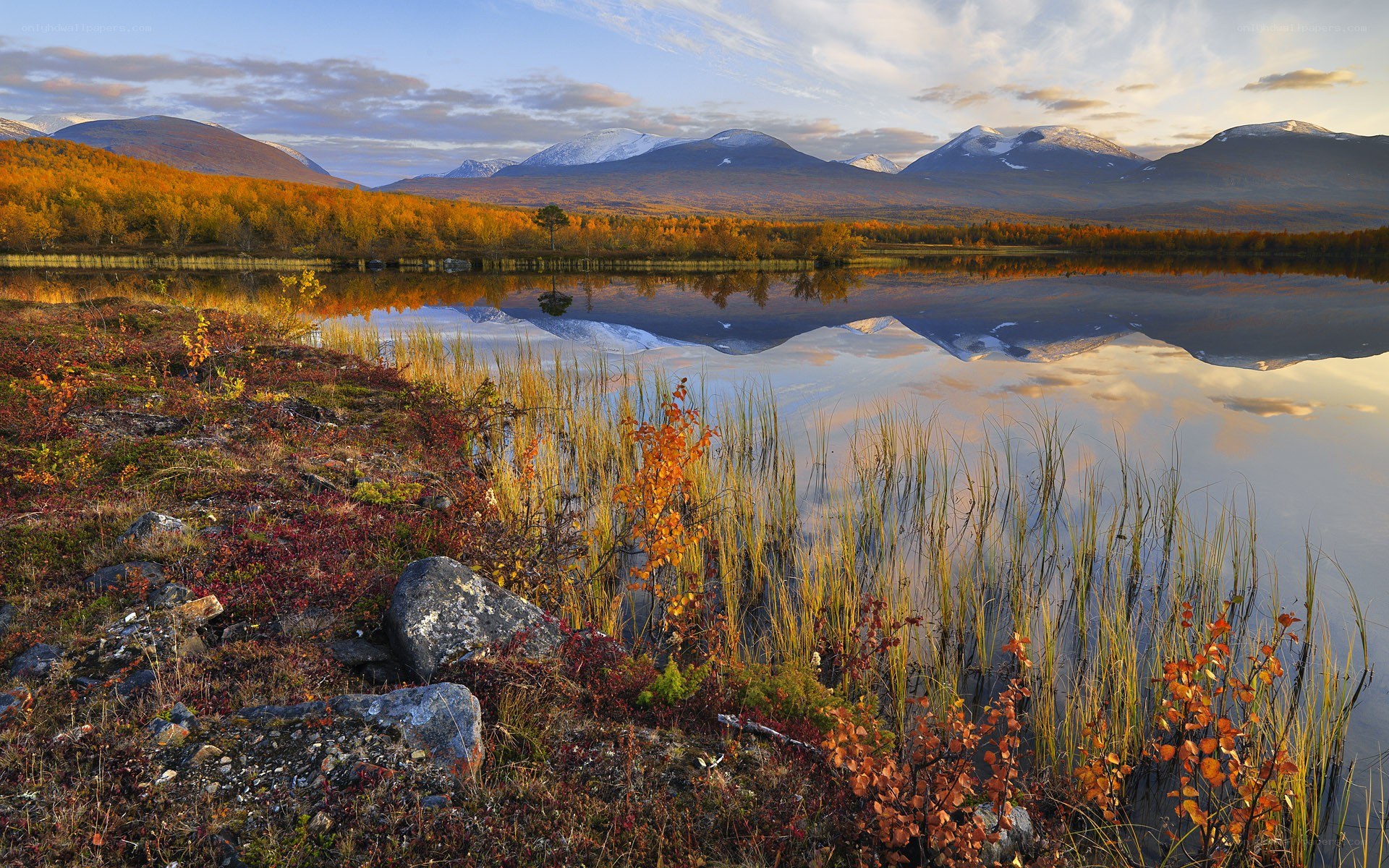 Autumn lake with mountain reflection