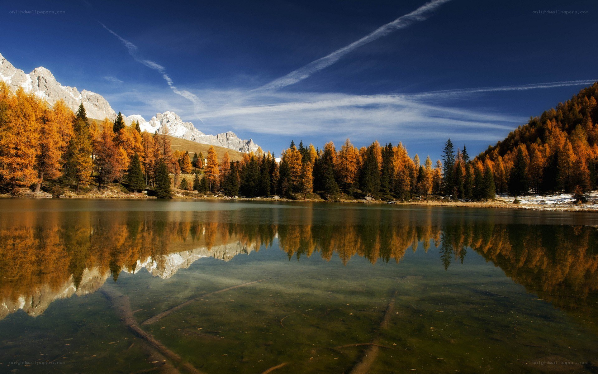 Autumn lake with mountain reflection