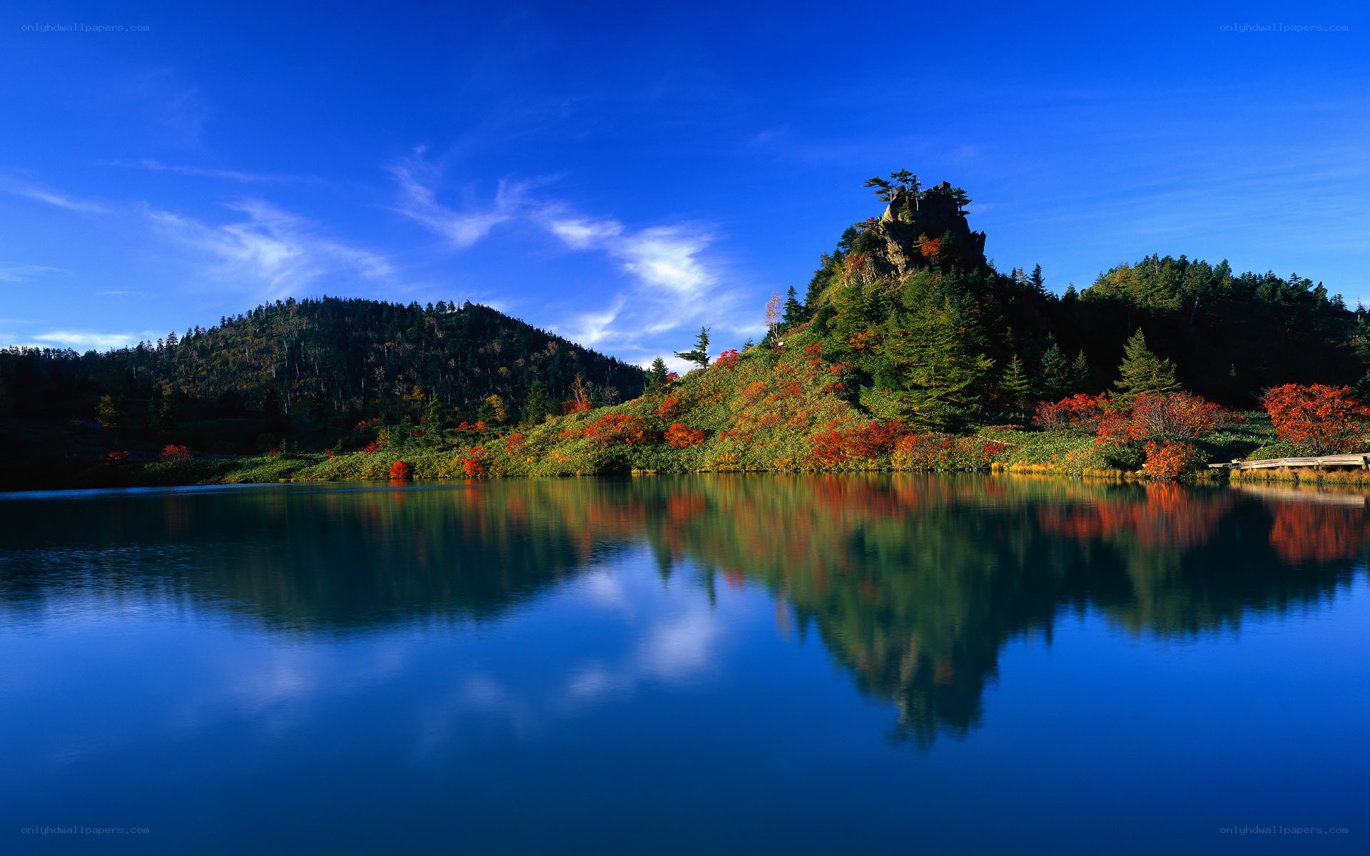 Autumn lake with mountain reflection