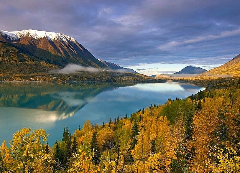 Autumn lake with mountain reflection