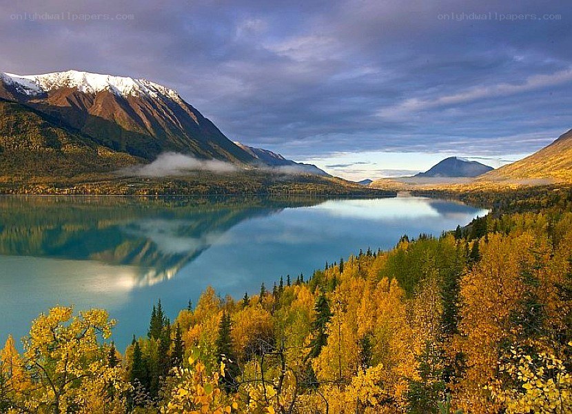 Autumn lake with mountain reflection