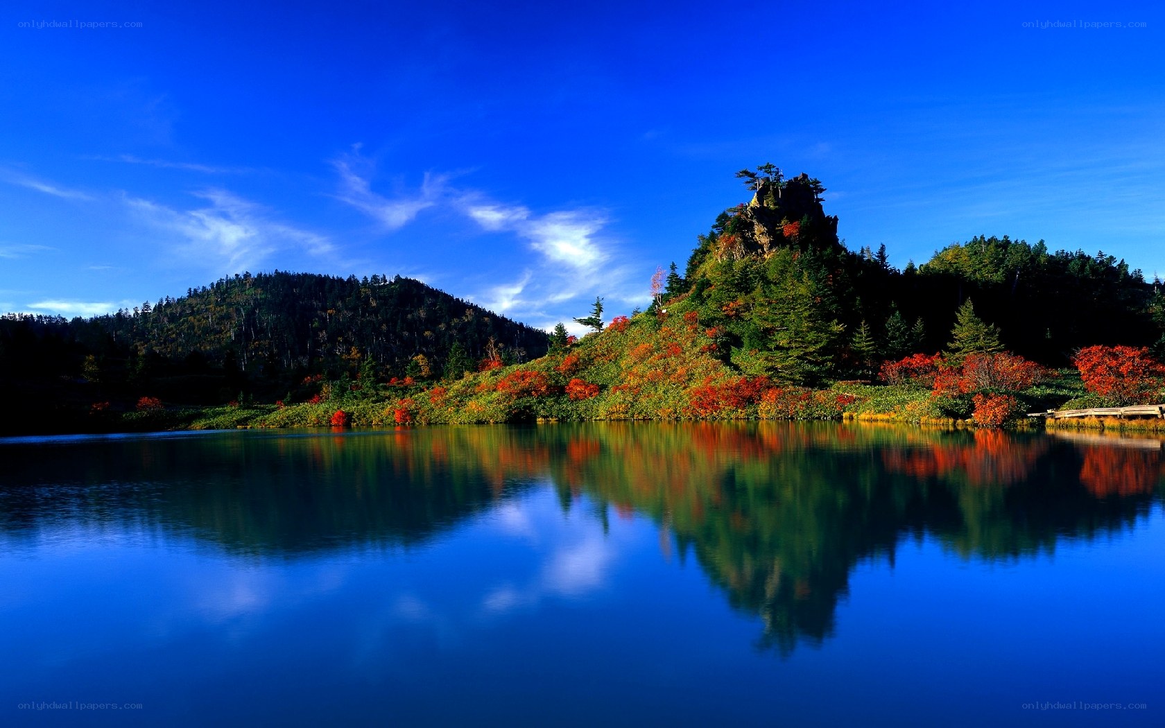 Autumn lake with mountain reflection