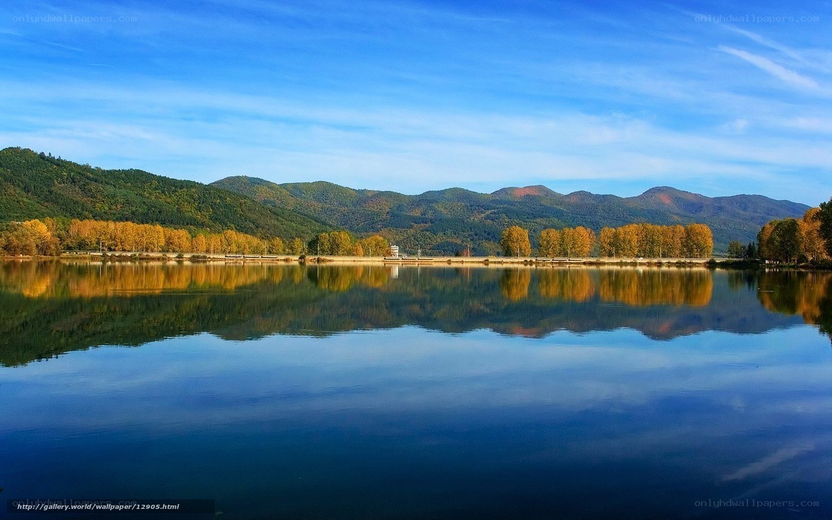 Autumn lake with mountain reflection