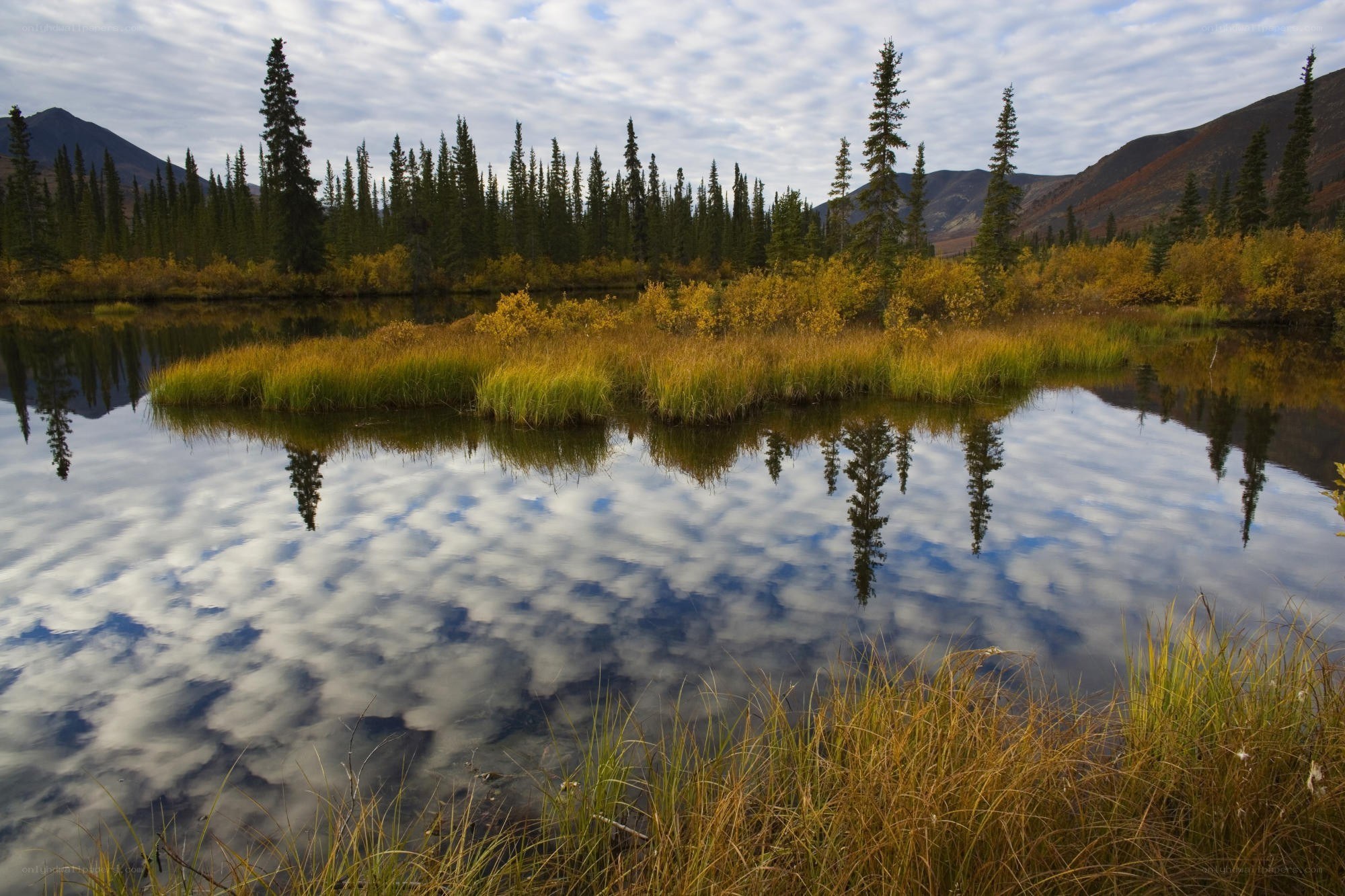 Autumn lake with mountain reflections