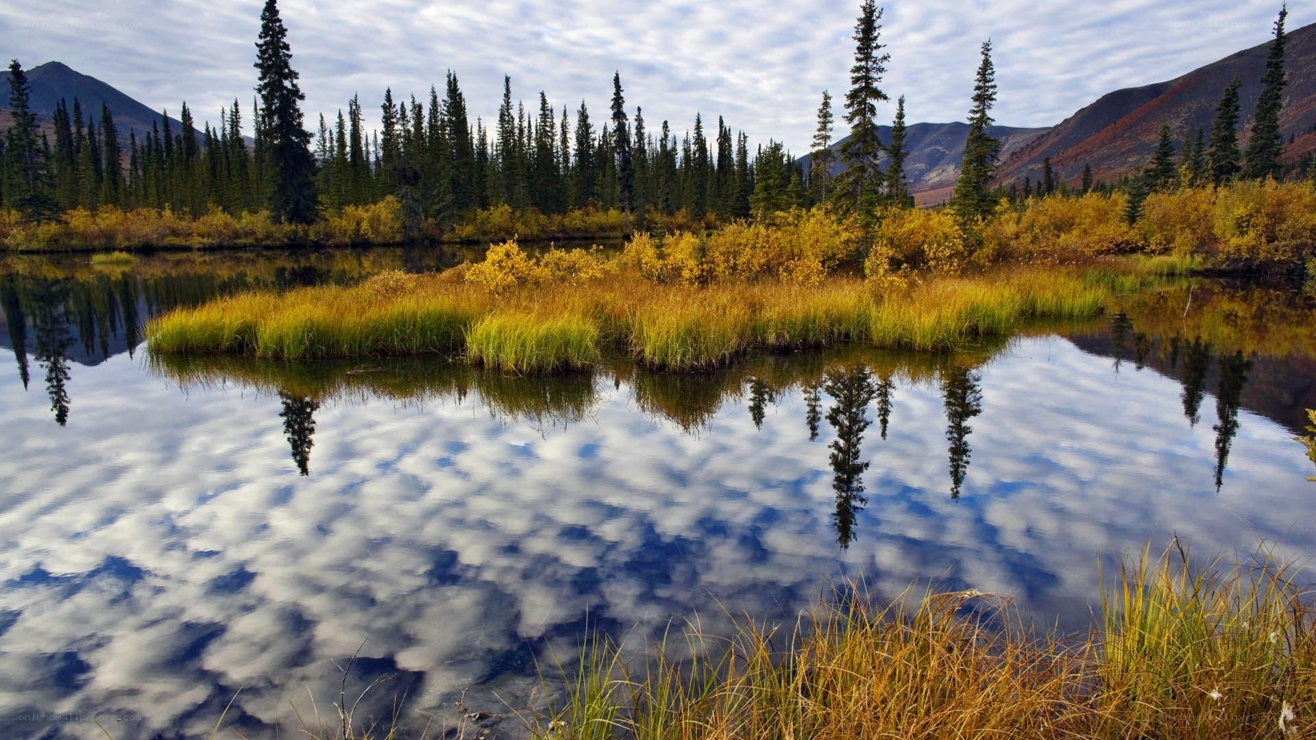Autumn lake with mountain reflections