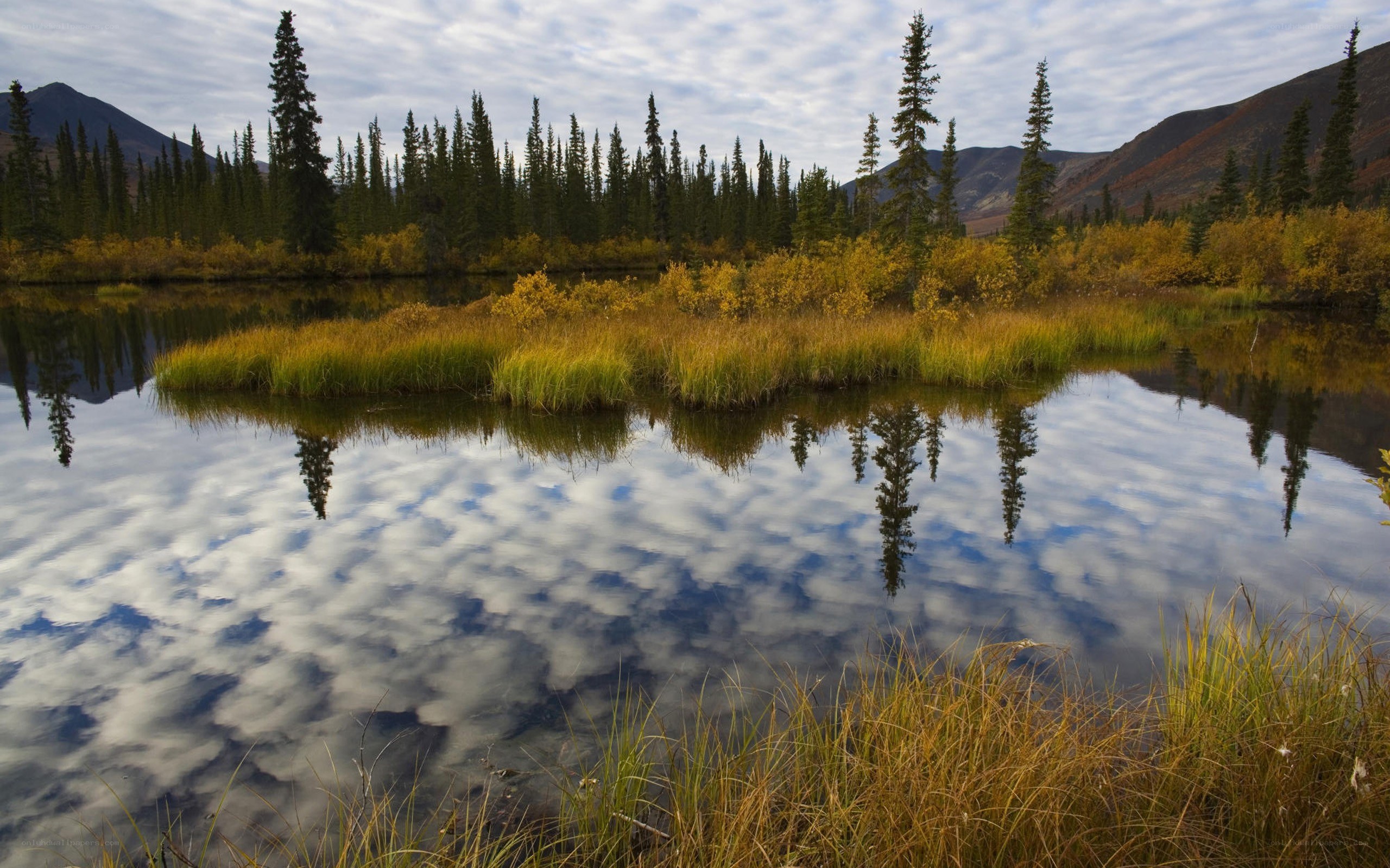 Autumn lake with mountain reflections