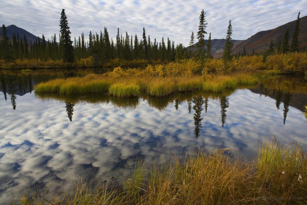 Autumn lake with mountain reflections