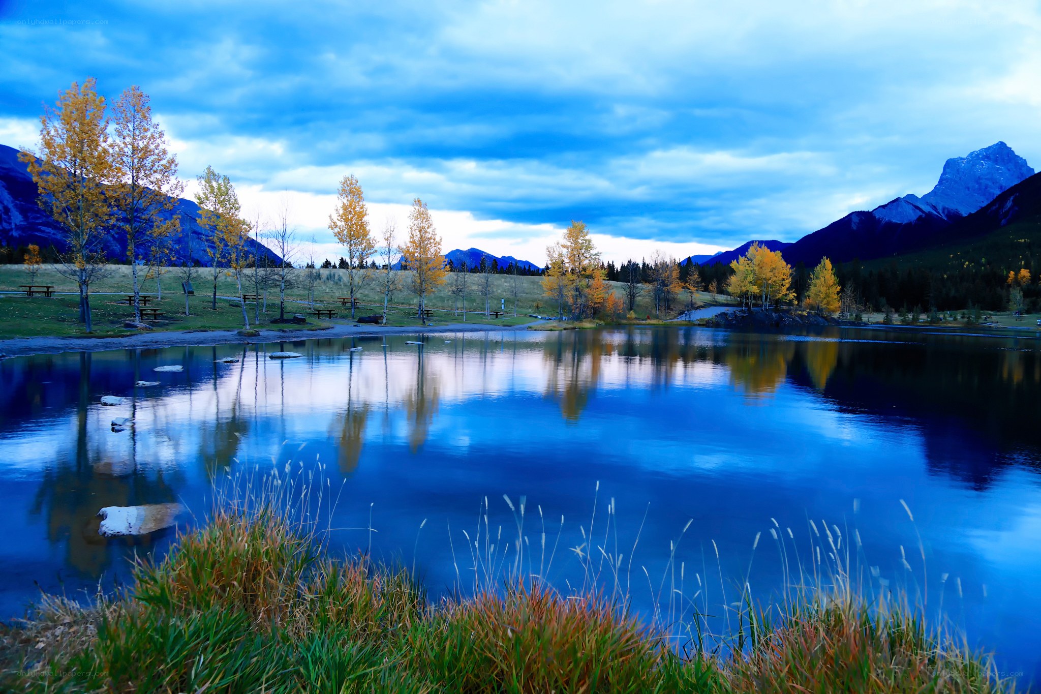 Autumn lake with mountain reflections